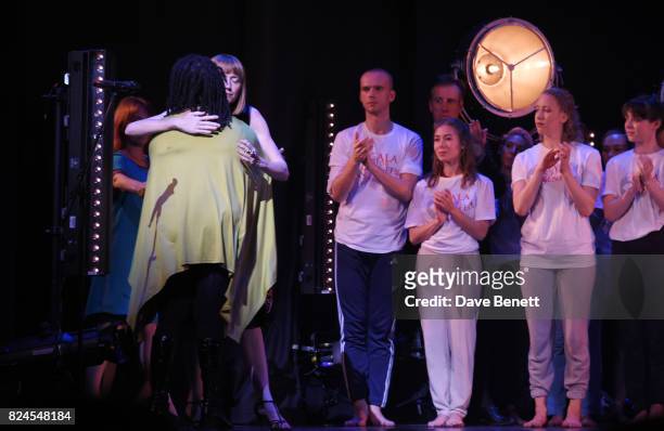 Grenfell community members Judy Bolton and Melanie Phelan embrace onstage as dancers look on at the curtain call during the 'Gala For Grenfell',...