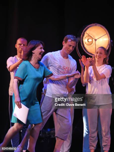 Director Arlene Phillips is led onstage by dancer Edward Watson at the curtain call during the 'Gala For Grenfell', bringing together a host of the...
