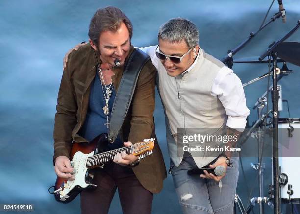 Jonathan Cain and Arnel Pineda of Journey perform onstage during The Classic East - Day 2 at Citi Field on July 30, 2017 in New York City.