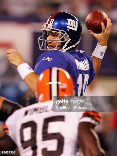 Eli Manning of the New York Giants throws a pass against the Cleveland Browns on August 18, 2008 at Giants Stadium in East Rutherford, New Jersey.