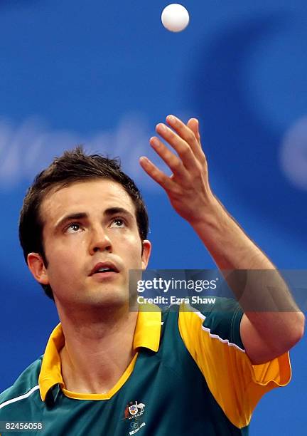 William Henzell of Australia plays against Idir Khourta of Algeria during the Men's Singles Preliminary Round held at the Peking University Gymnasium...