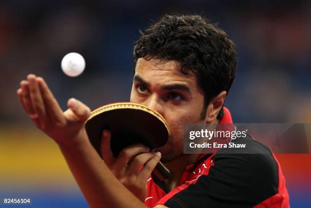 Ali Saleh Ahmed of Egypt serves to Kyle Davis of Australia during the Men's Singles Preliminary Round held at the Peking University Gymnasium during...