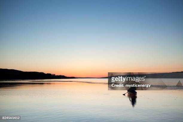 canoeing in to the sunset at buffalo pound provincial park saskatchewan canada - saskatchewan stock pictures, royalty-free photos & images