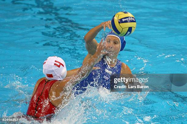 Manuela Zanchi of Italy looks to pass over the defense of Sun Yujun of China in the women's classification 5th-6th place match at the Ying Tung...