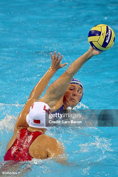 Martina Miceli of Italy looks to pass over the defense Sun Yating of China in the women's classification 5th-6th place match at the Ying Tung...