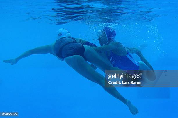 Tania Di Mario of Italy He Jin of China fight under water during the women's classification 5th-6th place match at the Ying Tung Natatorium on Day 11...