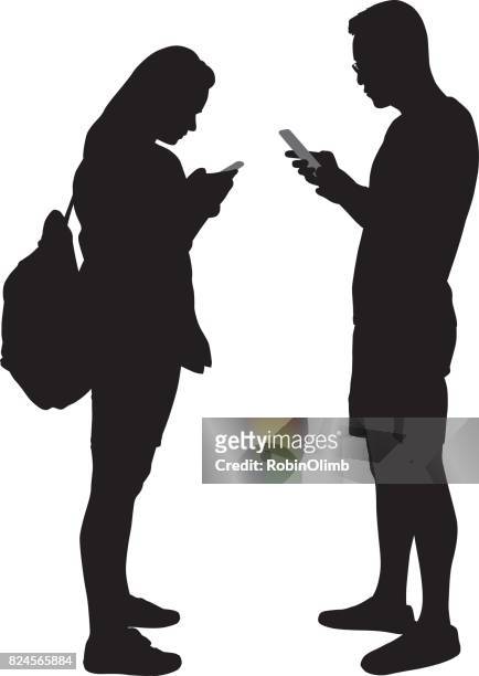 ilustrações de stock, clip art, desenhos animados e ícones de young man and woman using smart phones silhoettes - mulher celular