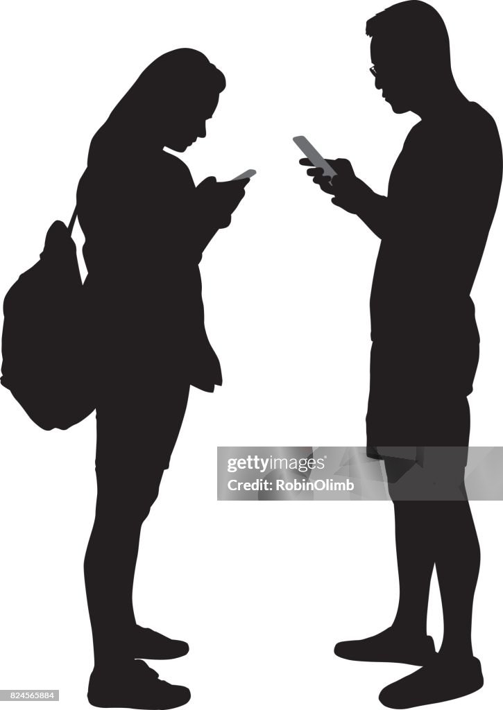 Young Man And Woman Using Smart Phones Silhoettes