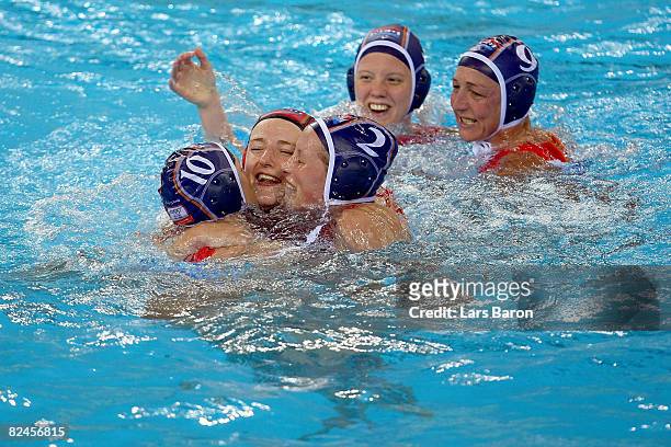 Goalkeeper Ilse Van Der Meijden, Yasemin Smit and Alette Sijbring of the Netherlands celebrate their 8-7 win over Hungary in the women's water polo...
