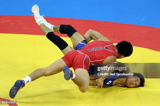 Henry Cejudo of the United States competes against Shingo Matsumoto of Japan for the gold medal in the men's 55kg freestyle wrestling event at the...