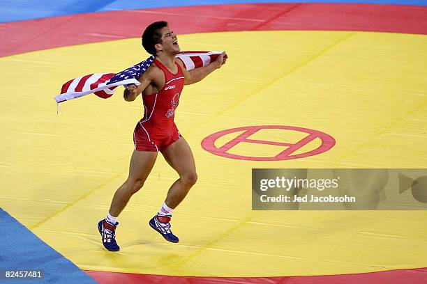 Henry Cejudo of the United States celebrates after defeating Shingo Matsumoto of Japan to win the gold medal in the men's 55kg freestyle wrestling...