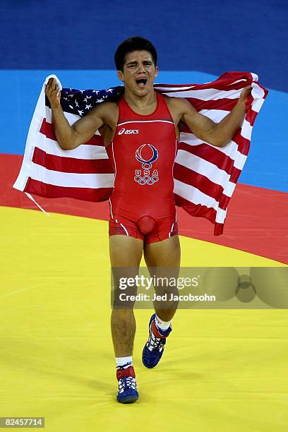 Henry Cejudo of the United States celebrates after defeating Shingo Matsumoto of Japan to win the gold medal in the men's 55kg freestyle wrestling...