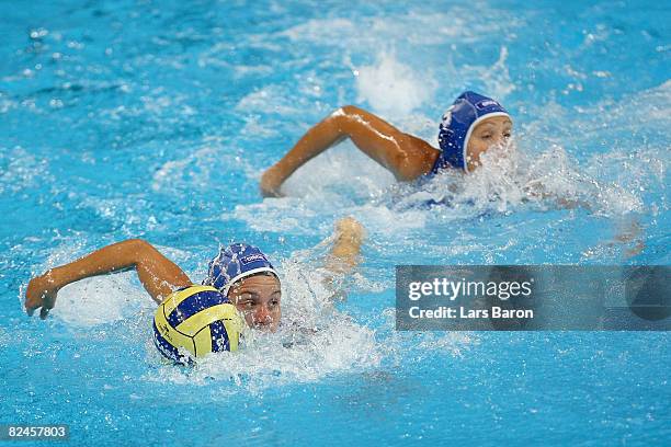 Manuela Zanchi and Tania Di Mario of Italy swim against China in the women's classification 5th-6th place match at the Ying Tung Natatorium on Day 11...