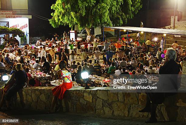 Greek People celebrate the christening of a baby with their traditional dance sirtaci on July 20, 2008 in Sianna, Rhodes, Greece. Rhodes is the...