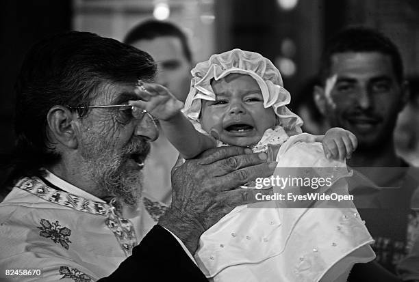 Greek People celebrate the christening of a baby with their traditional dance sirtaci on July 20, 2008 in Sianna, Rhodes, Greece. Rhodes is the...