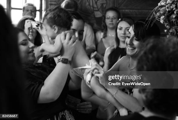 Greek People celebrate the christening of a baby on July 20, 2008 in Sianna, Rhodes, Greece. Rhodes is the largest of the greek Dodecanes Islands.