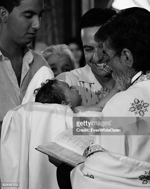 Greek People celebrate the christening of a baby on July 20, 2008 in Sianna, Rhodes, Greece. Rhodes is the largest of the greek Dodecanes Islands.