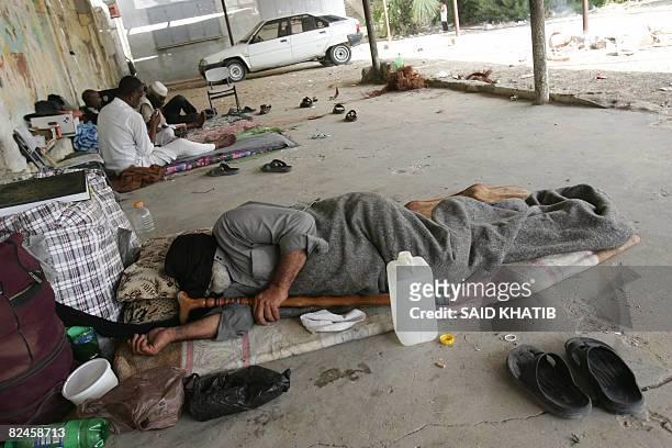 Elderly Egyptians stranded in the Gaza Strip due to the Israeli closure of the crossing between southern Gaza and Egypt, sleep on the floor of a...