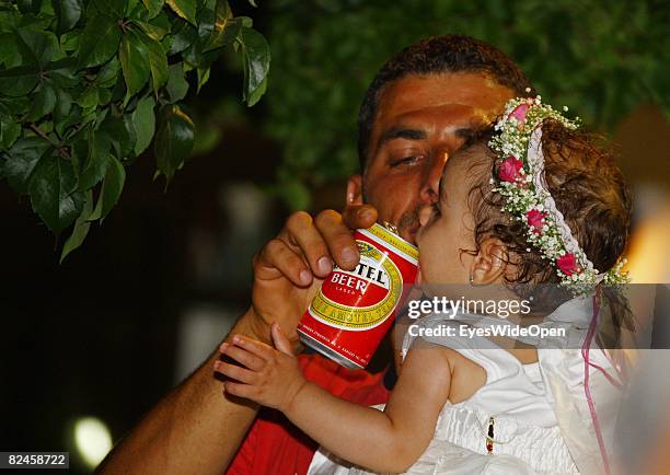 Greek People celebrate the christening of a baby with their traditional dance sirtaci on July 20, 2008 in Sianna, Rhodes, Greece. Rhodes is the...