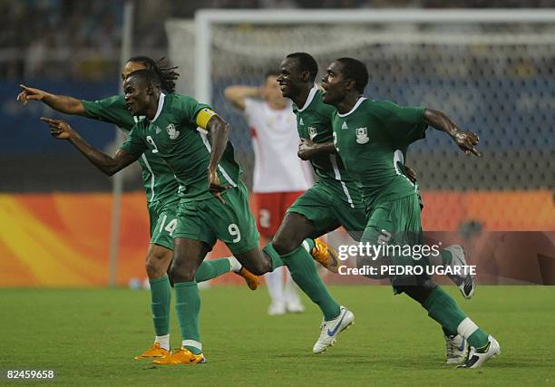 Chibuzor Okonkwo celebrates a goal with team-mate Sani kaita and Victor Obina during the 2008 Beijing Olympic Games men's semi-final football match...