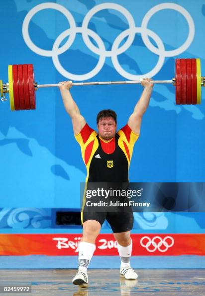 Matthias Steiner of Germany completes his final lift to win the