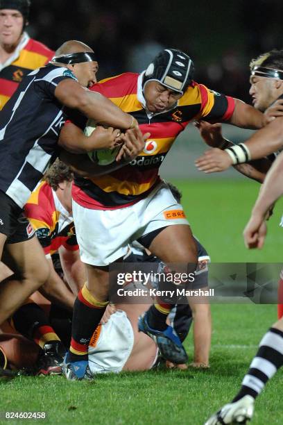 Ole Avei of Waikato is tackled by Sona Taumalolo and Hikawera Elliot of Hawkes Bay in the Air New Zealand Cup match between the Hawkes Bay and...