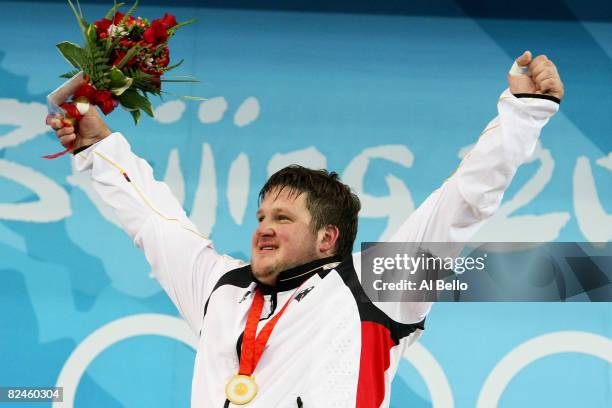 Matthias Steiner of Germany celebrates winning the gold medal in the Men's 105 kg group weightlifting event at the Beijing University of Aeronautics...