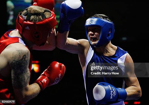 Tony Jeffries of Great Britain competes against Imre Szello of Hungary during the 81kg quarterfinal boxing event at the Workers' Indoor Arena on Day...