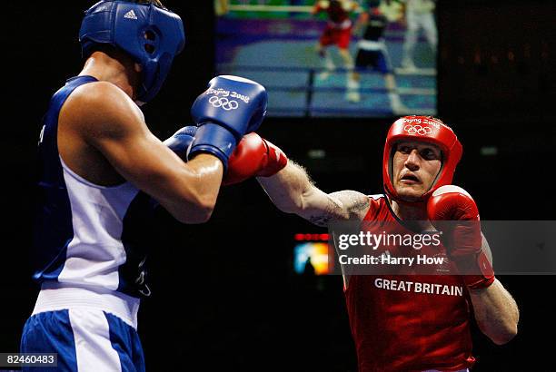 Tony Jeffries of Great Britain competes against Imre Szello of Hungary during the 81kg quarterfinal boxing event at the Workers' Indoor Arena on Day...