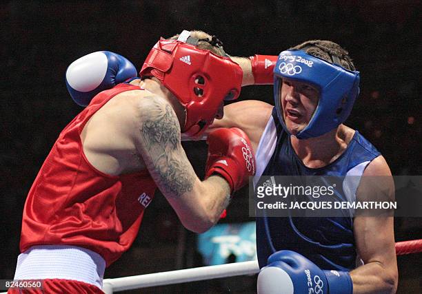Great Britain's Tony Jeffries fights against Hungary's Imre Szello during their 2008 Olympic Games Light Heavyweight quarterfinals boxing bout on...