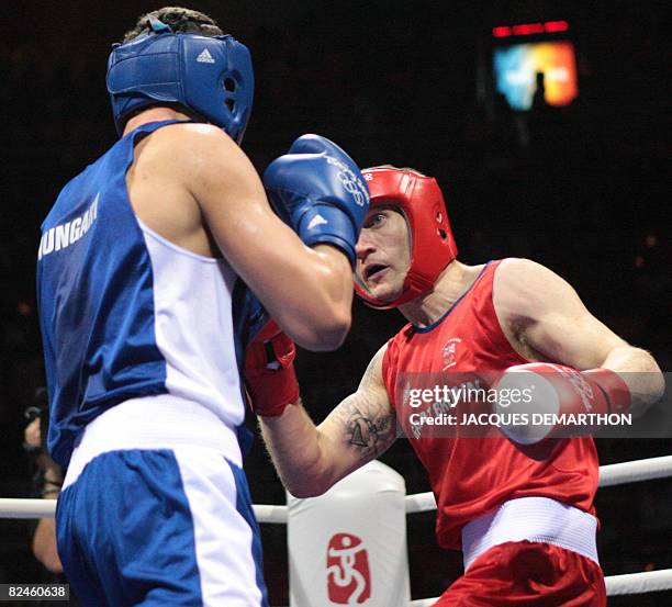 Great Britain's Tony Jeffries fights against Hungary's Imre Szello during their 2008 Olympic Games Light Heavyweight quarterfinals boxing bout on...