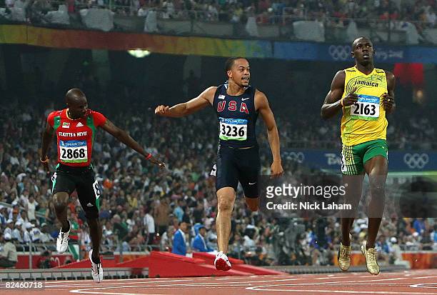 Kim Collins of Saint Kitts and Nevis, Wallace Spearmon of the United States and Usain Bolt of Jamaica compete in the Men's 200m Heats held at the...