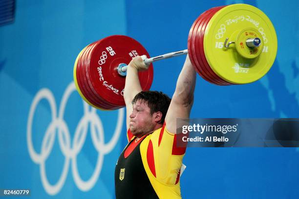 Matthias Steiner of Germany completes his final lift to win the gold medal in the Men's 105 kg group weightlifting event at the Beijing University of...