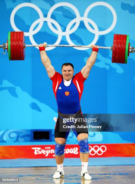 Evgeny Chigishev of Russia completes a lift during the Men's 105 kg group weightlifting event at the Beijing University of Aeronautics & Astronautics...