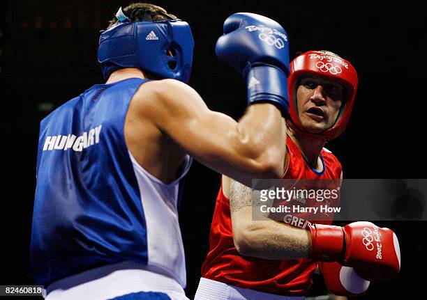 Tony Jeffries of Great Britain competes against Imre Szello of Hungary during the 81kg quarterfinal boxing event at the Workers' Indoor Arena on Day...