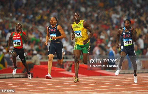 Kim Collins of Saint Kitts and Nevis, Wallace Spearmon of the United States, Usain Bolt of Jamaica and Shawn Crawford of the United States compete in...