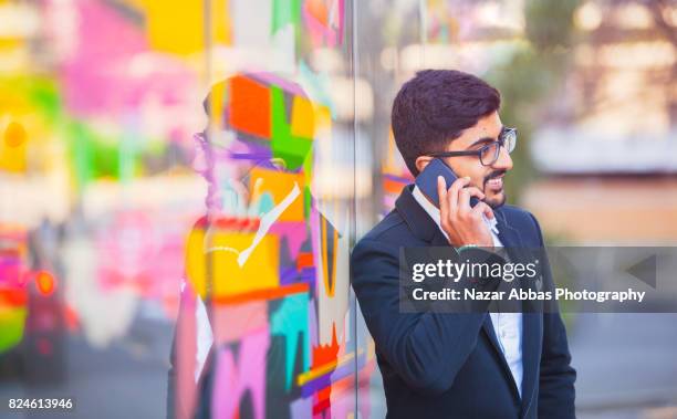 talking on phone. - auckland university stock pictures, royalty-free photos & images