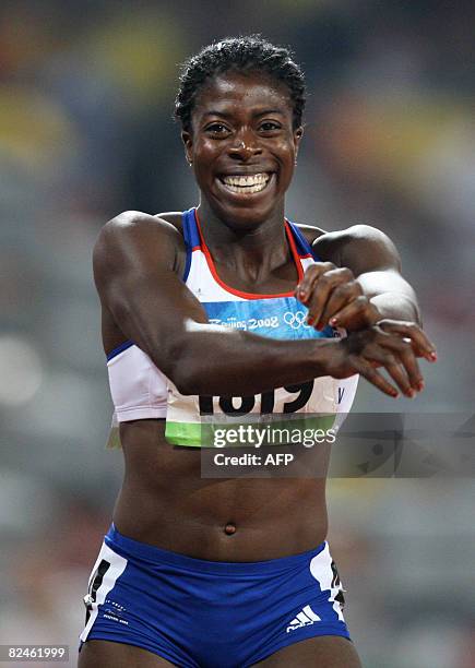 Britain's Christine Ohuruogu celebrates winning gold in the women's 400m final at the "Bird's Nest" National Stadium during the 2008 Beijing Olympic...