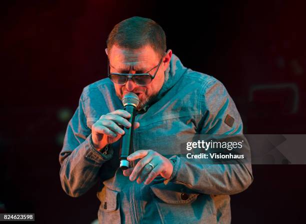 Shaun Ryder of Happy Mondays performs with the band on the main stage at Kendal Calling Festival at Lowther Deer Park on July 28, 2017 in Kendal,...