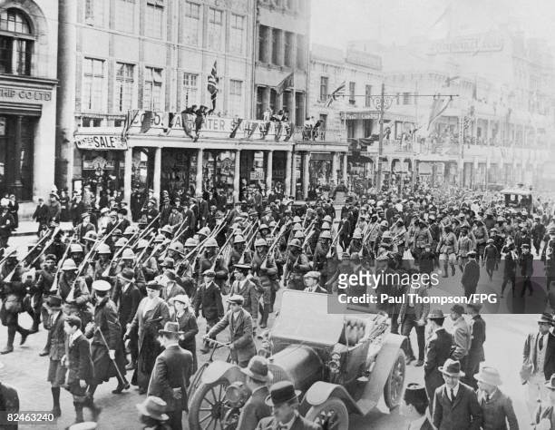The CFA marches along Adderley Street in Cape Town, upon their return from German South West Africa, 1915. They are en route to the City Hall, where...