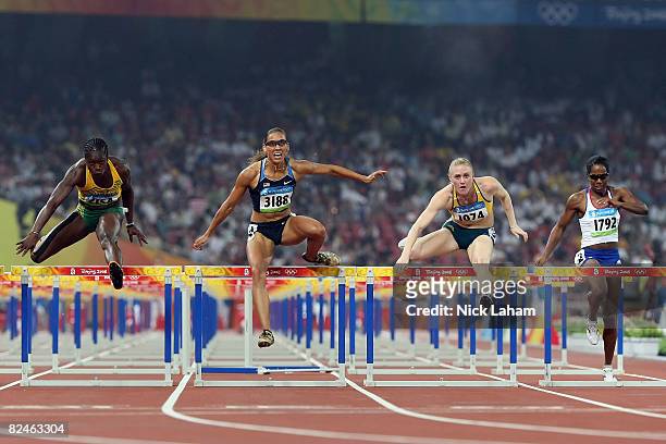 Delloreen Ennis-London of Jamaica, Lolo Jones of the United States, Sally McLellan of Australia and Sarah Claxton of Great Britain compete in the...