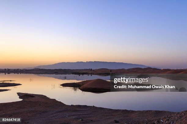 tilapia lake, al-ain, abu dhabi - abu dhabi sunrise stock pictures, royalty-free photos & images