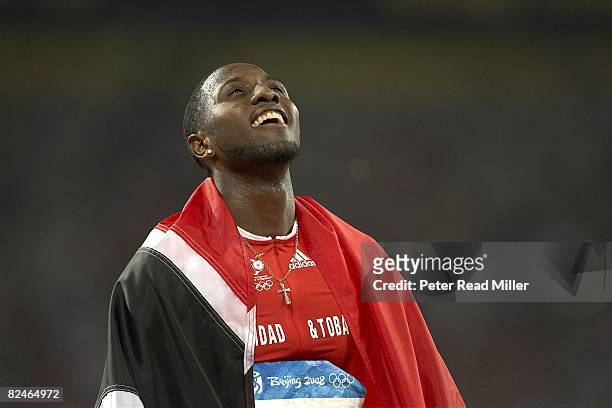 Summer Olympics: Trinidad & Tobago Richard Thomson victorious with silver medal win during Men's 100M Final at National Stadium . Beijing, China...