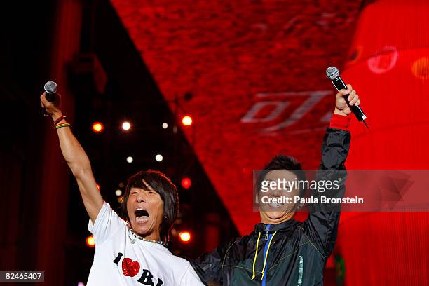 Chinese singing duo Yu Quan perform at the Olympic Shuang Zone August 19, 2008 in Beijing, China. The Shuang Zone, sponsored by Coca Cola allows...