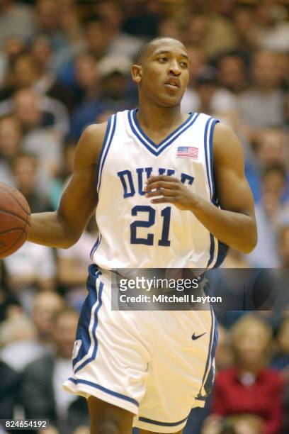 Chris Duhon of the Duke Blue Devils dribbles up court during a college basketball game against the Georgetown Hoyas at Cameron Indoor Stadium on...