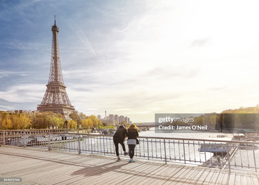 Tourist couple looking at The Eiffel Tower, Paris, France