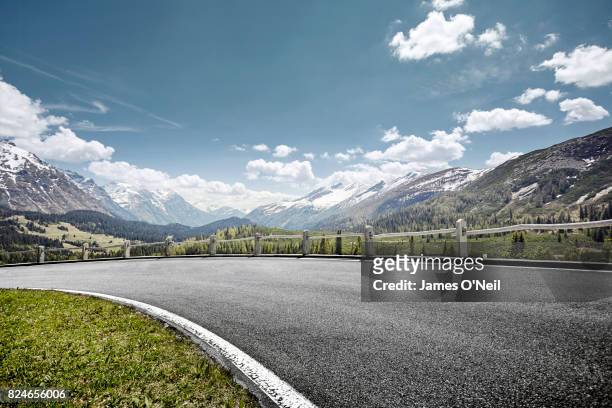 curved empty road on mountain pass, san bernardino, switzerland - crash barrier stock pictures, royalty-free photos & images