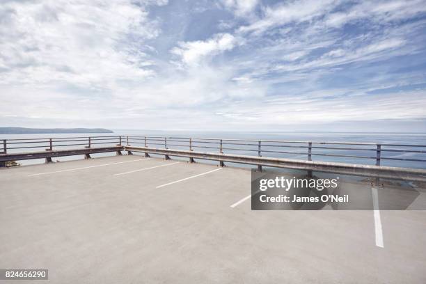 open carpark overlooking the sea - crash barrier stock pictures, royalty-free photos & images