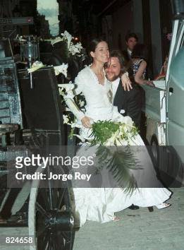 Rufus, the Earl of Albemarle holds his new wife, Sally Tadoyan after ...