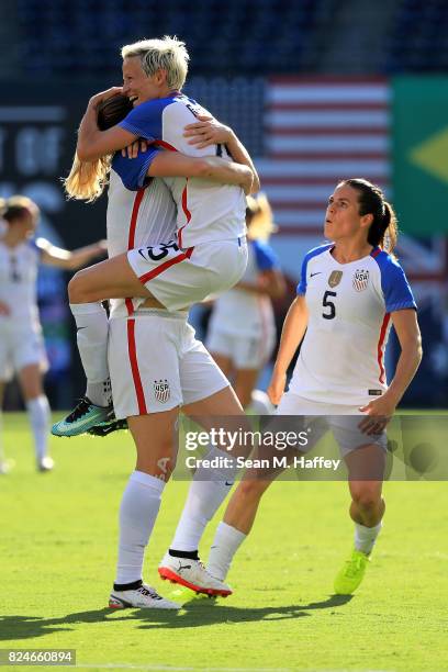 Kelley O'Hara, Megan Rapinhoe, and Becky Sauerbrunn of the United States celebrate a goal against Brazil during the first half of a match in the 2017...